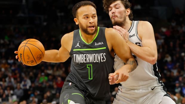 Dec 6, 2023; Minneapolis, Minnesota, USA; Minnesota Timberwolves forward Kyle Anderson (1) drives past San Antonio Spurs forward Cedi Osman (16) in the third quarter at Target Center.